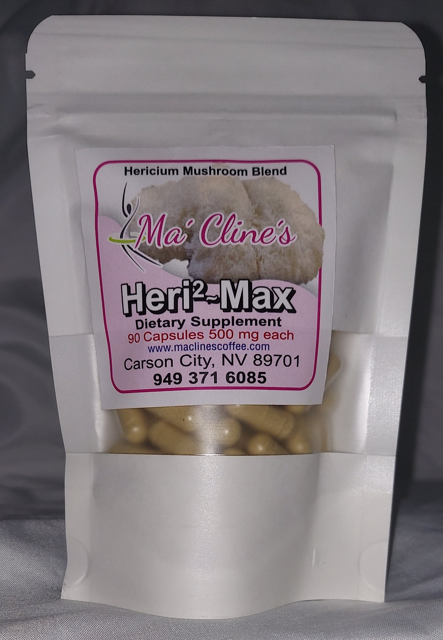 Photo of the bag and front label of Ma' Cline's Heri2~Max a dietary supplement. Lion's Mane Mushroom Blend 90 food capsules 500 mg each. www.maclinescoffee.com, Carson City, NV 89701, 949-371-6085, background photo of Lion's Mane, hericium erinaceus, which looks like a fuzzy lion's mane.