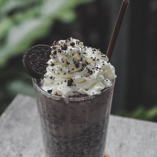 12 second video featuring a tall glass of shilled ChocoShroom chocolate with whipped cream on the top with an oreo cookie sticking out of the whipped cream. Text superimposed says "Yes! with MaClinesShoppe.com  